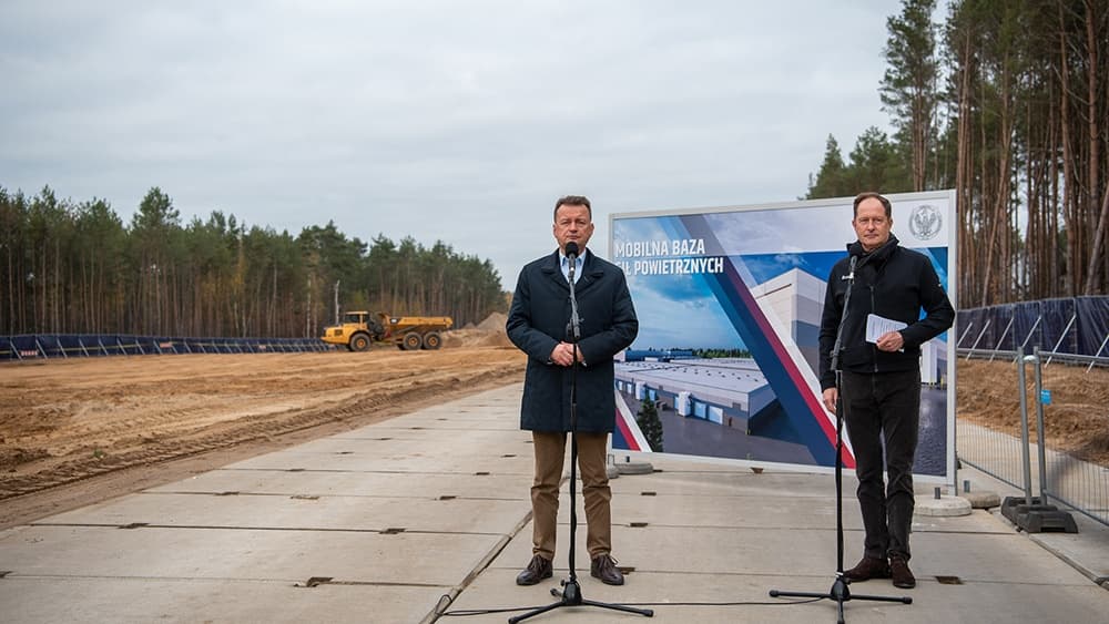 Powidz Air Base construction site with officials - Mobile Air Force Base development